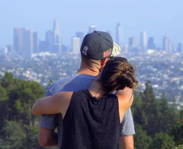 Man and Woman Hugging against L.A. Skyline